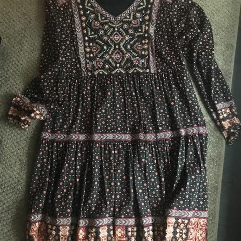 Knee length, gathered multi-pattern dress.